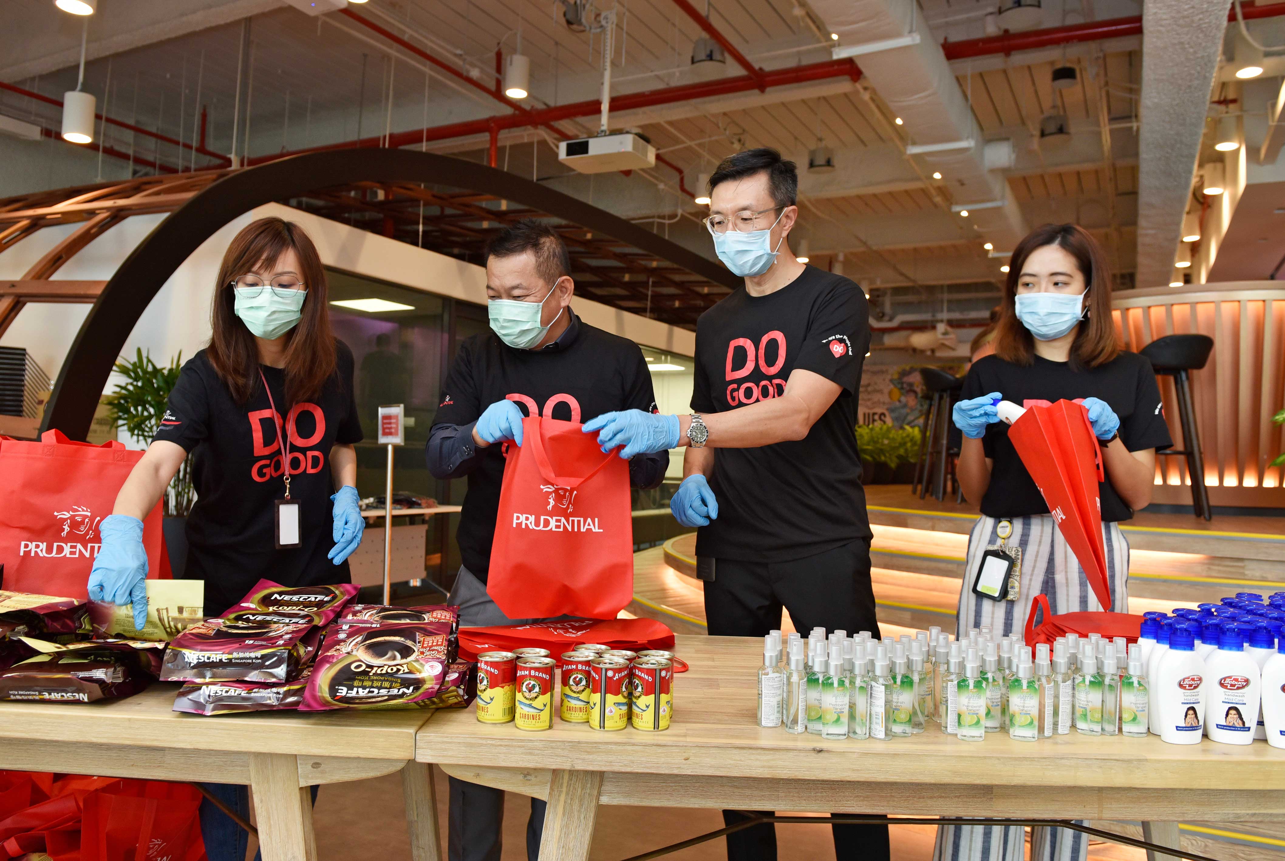 Lead policy writer, Noreen Wee, 63, and colleagues participating in Prudential’s ‘Sports Day’ activities